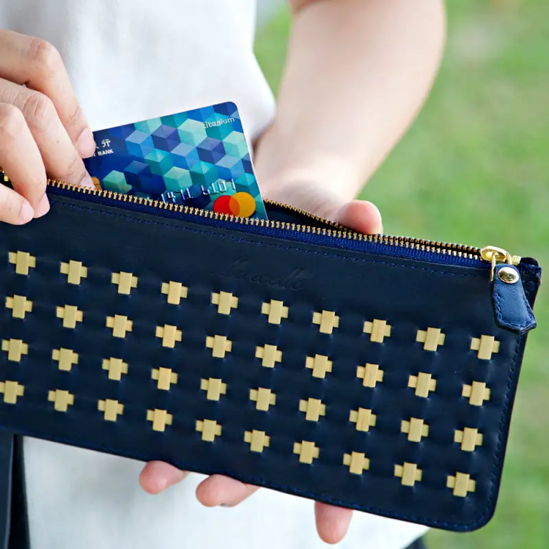 blue woven clutch and card